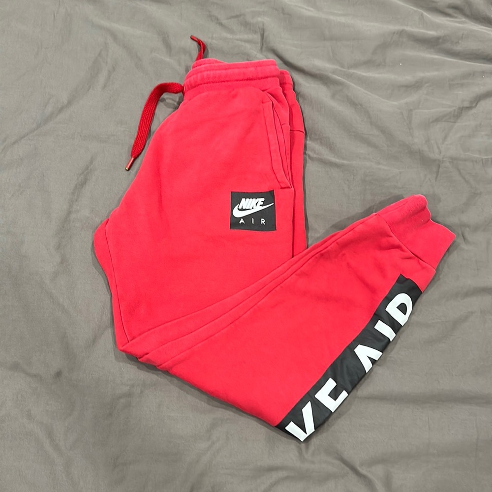 Red and black Nike joggers size small